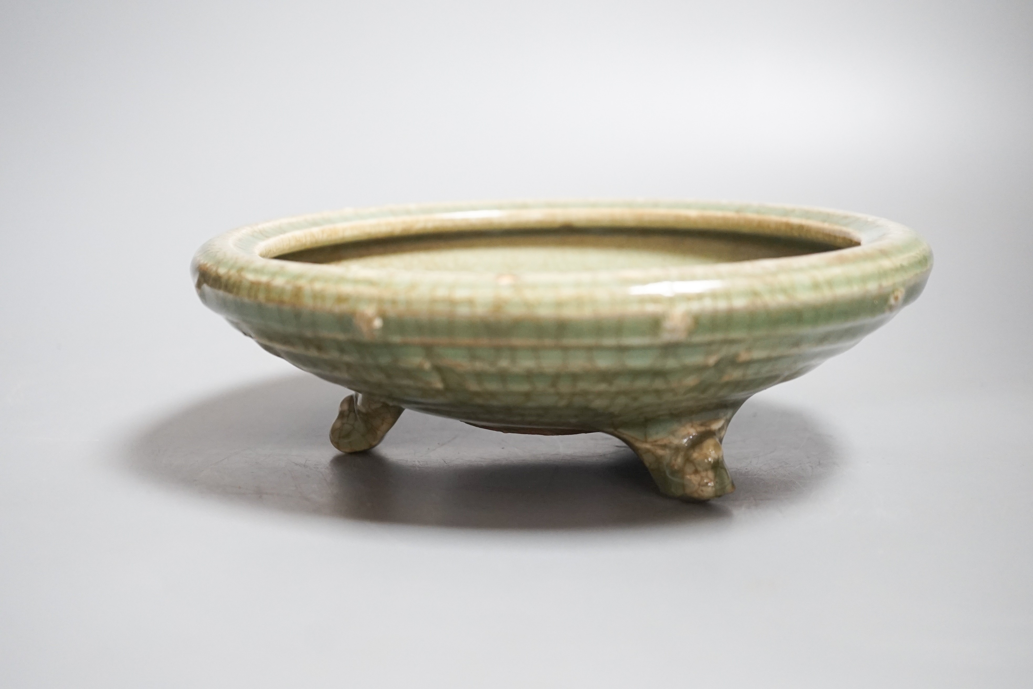 A Chinese celadon tripod censer, possibly Ming dynasty, 20.5cm